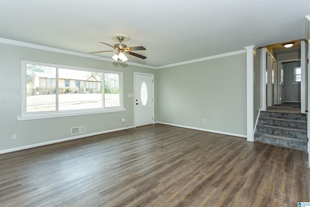 unfurnished living room featuring dark hardwood / wood-style flooring, crown molding, and ceiling fan