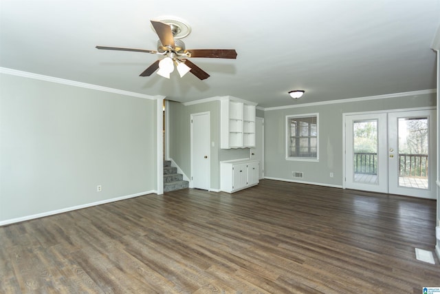 unfurnished living room featuring visible vents, baseboards, dark wood-style floors, and stairs