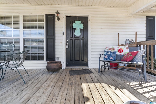 entrance to property featuring a porch