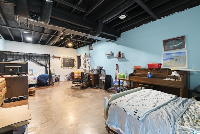 bedroom featuring concrete flooring