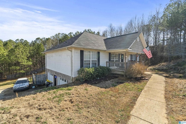 single story home with a garage and covered porch