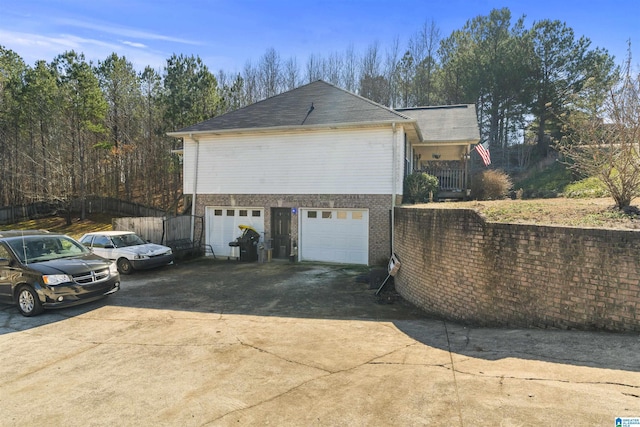 view of side of home with a garage