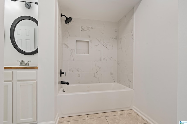 bathroom with tiled shower / bath combo, vanity, and tile patterned floors