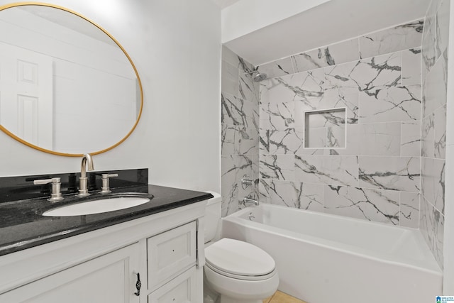 full bathroom featuring vanity, toilet, and tiled shower / bath