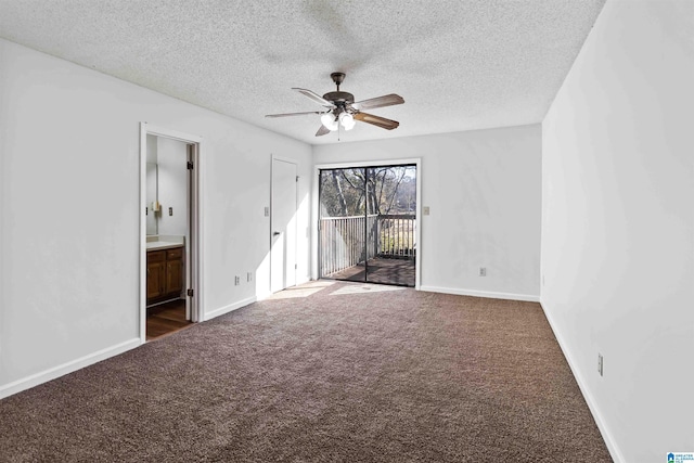 carpeted spare room featuring ceiling fan and a textured ceiling