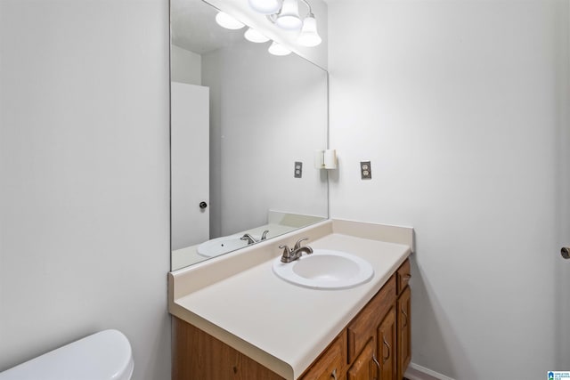 bathroom with vanity and toilet