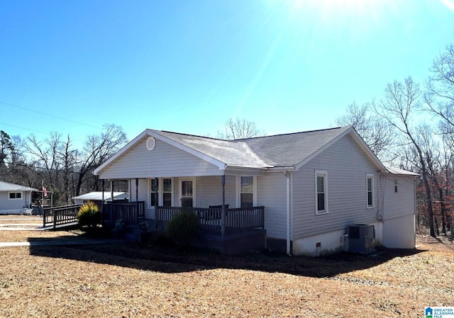 view of front of home featuring central AC unit and a porch