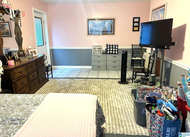 bedroom with light tile patterned floors