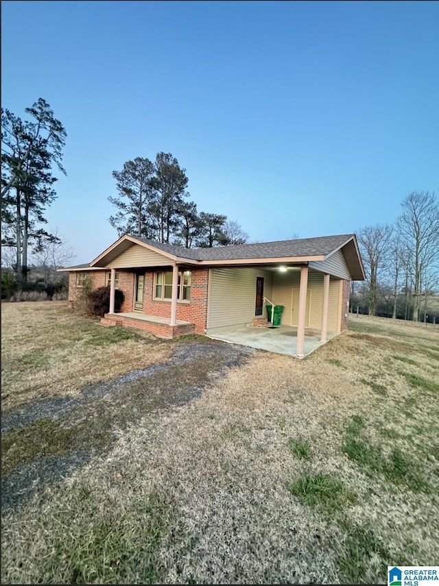 single story home featuring a patio area and a front yard