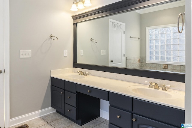 bathroom featuring ornamental molding, tile patterned floors, and vanity