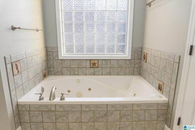 bathroom with a relaxing tiled tub