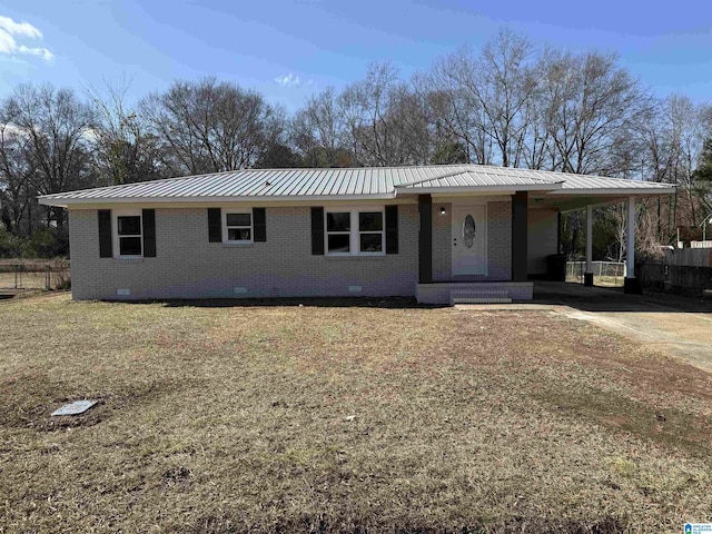 ranch-style house featuring a carport