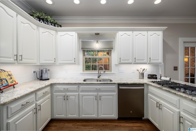 kitchen with ornamental molding, stainless steel appliances, sink, and white cabinets