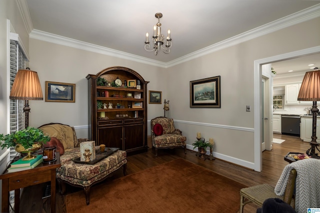 sitting room featuring dark hardwood / wood-style flooring, a notable chandelier, and crown molding