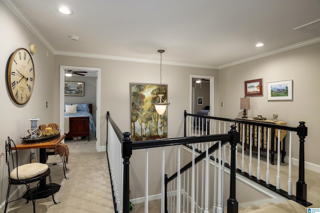 corridor featuring crown molding and light carpet