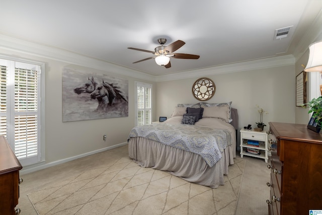 carpeted bedroom featuring crown molding, ceiling fan, and multiple windows