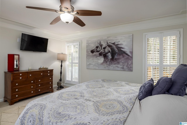 bedroom featuring multiple windows, ornamental molding, and light colored carpet