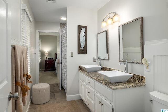 bathroom with vanity and toilet