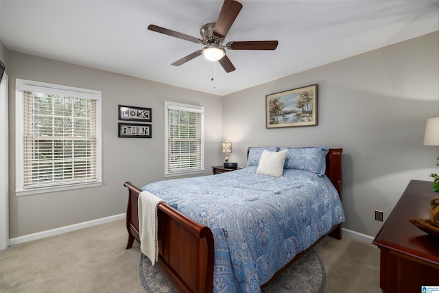 bedroom with ceiling fan and carpet