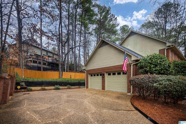 view of side of home with a garage