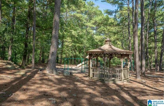 view of yard with a gazebo and a playground