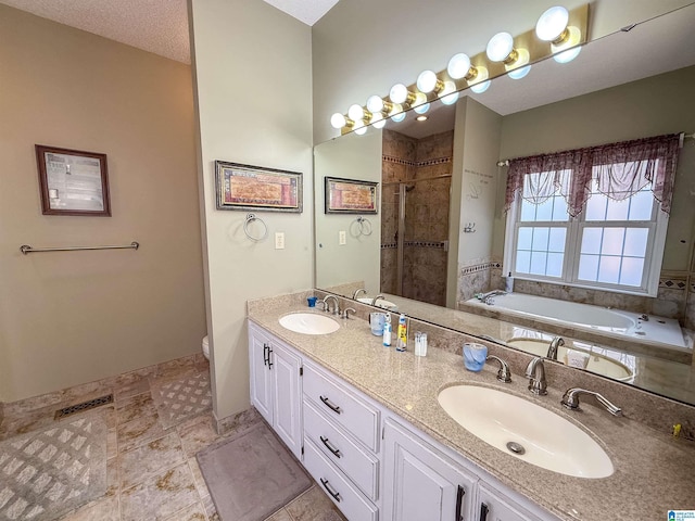 full bathroom featuring vanity, separate shower and tub, and toilet