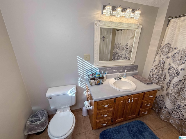 bathroom with vanity, toilet, and tile patterned flooring