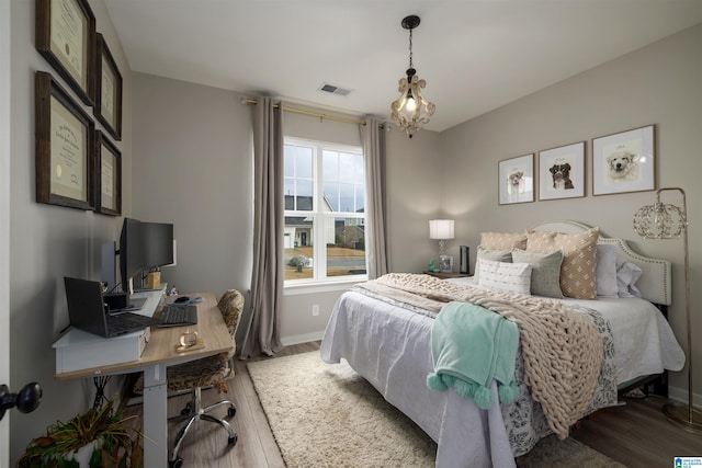 bedroom featuring wood-type flooring