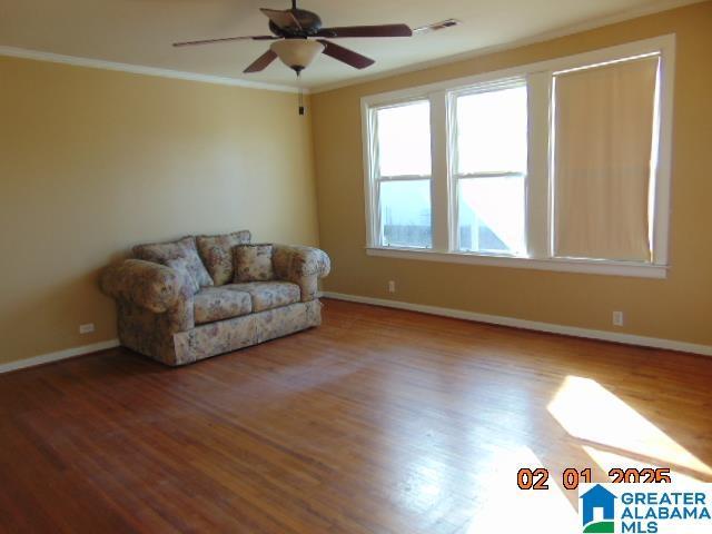 unfurnished room featuring crown molding, ceiling fan, and hardwood / wood-style flooring