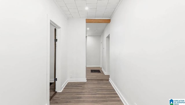 hallway featuring dark hardwood / wood-style flooring