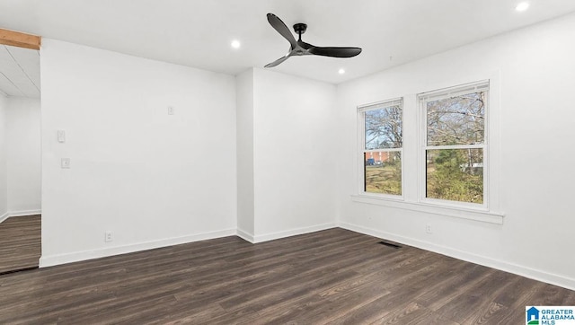 unfurnished room featuring dark hardwood / wood-style flooring and ceiling fan