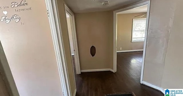 corridor with dark wood-type flooring