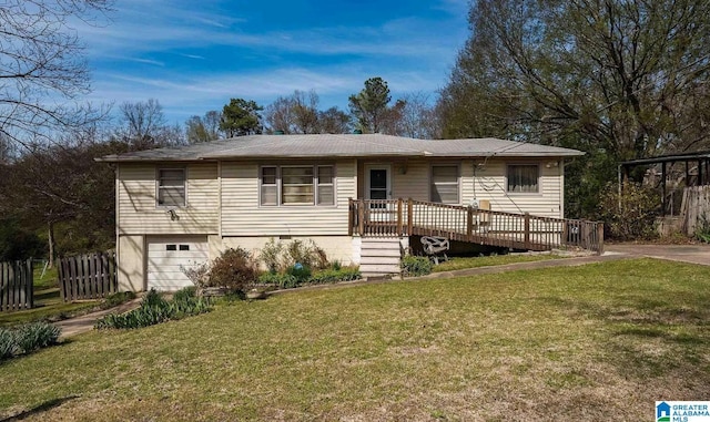 view of front facade featuring a garage, a front lawn, and a deck