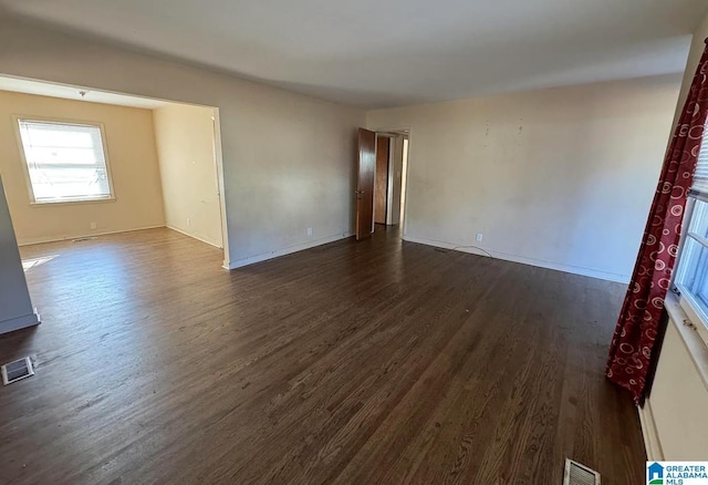 empty room featuring dark hardwood / wood-style floors