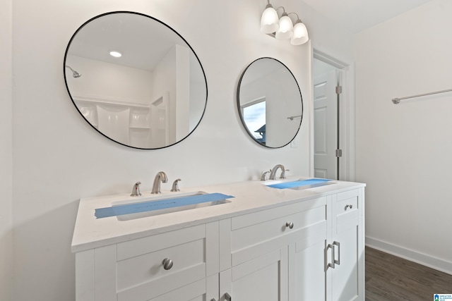 bathroom featuring vanity and wood-type flooring