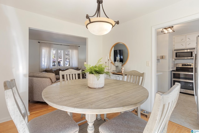 dining room featuring light hardwood / wood-style floors