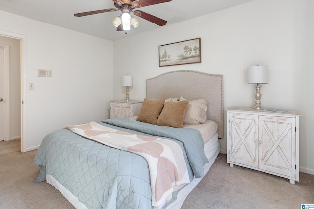 bedroom with light colored carpet and ceiling fan