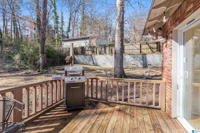 wooden terrace featuring grilling area