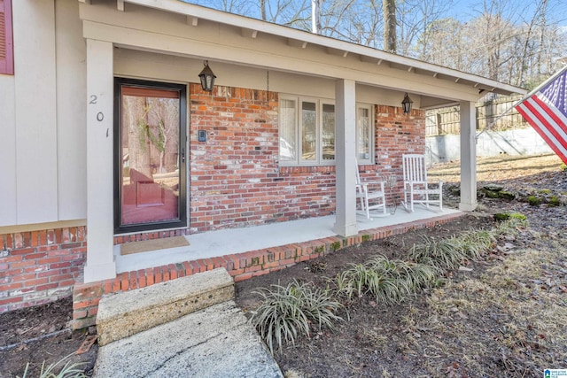 doorway to property featuring covered porch