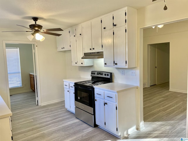 kitchen featuring electric stove, light hardwood / wood-style flooring, and white cabinets