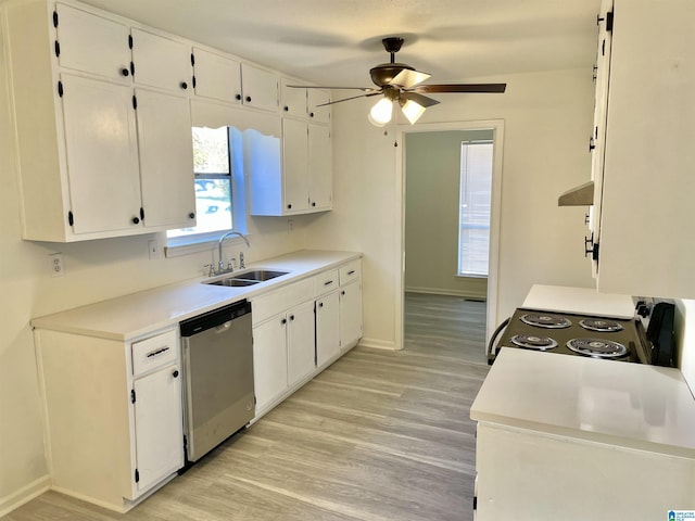 kitchen with sink, light wood-type flooring, dishwasher, white cabinets, and stove