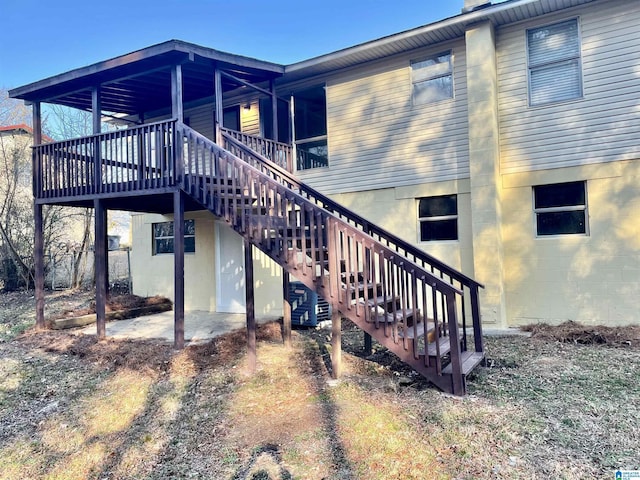 view of home's exterior with a wooden deck