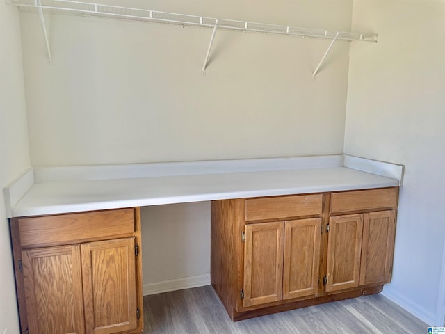 laundry area featuring light hardwood / wood-style floors