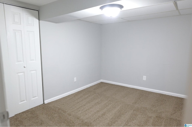 interior space with a paneled ceiling