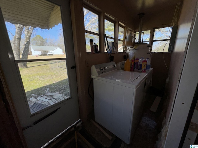 clothes washing area with washing machine and dryer