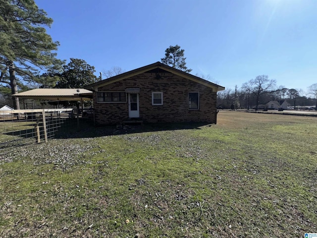 view of home's exterior featuring a yard