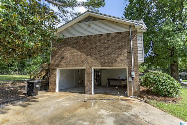 view of side of property featuring a garage