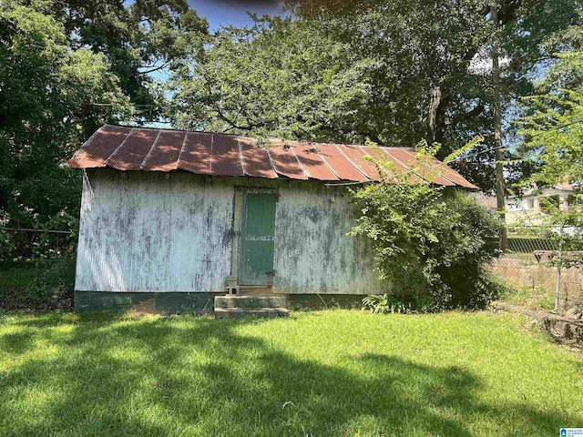 view of outdoor structure with a lawn