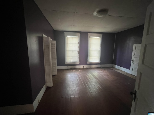 empty room featuring dark hardwood / wood-style flooring