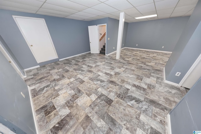 basement featuring a paneled ceiling